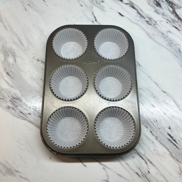 lining the muffin tin